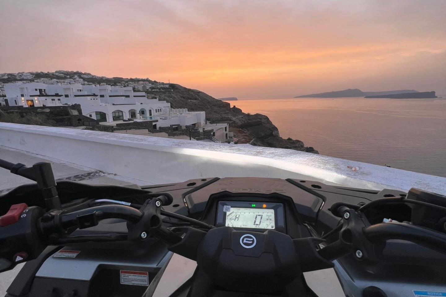 POV from inside an ATV cruising the Santorini coast