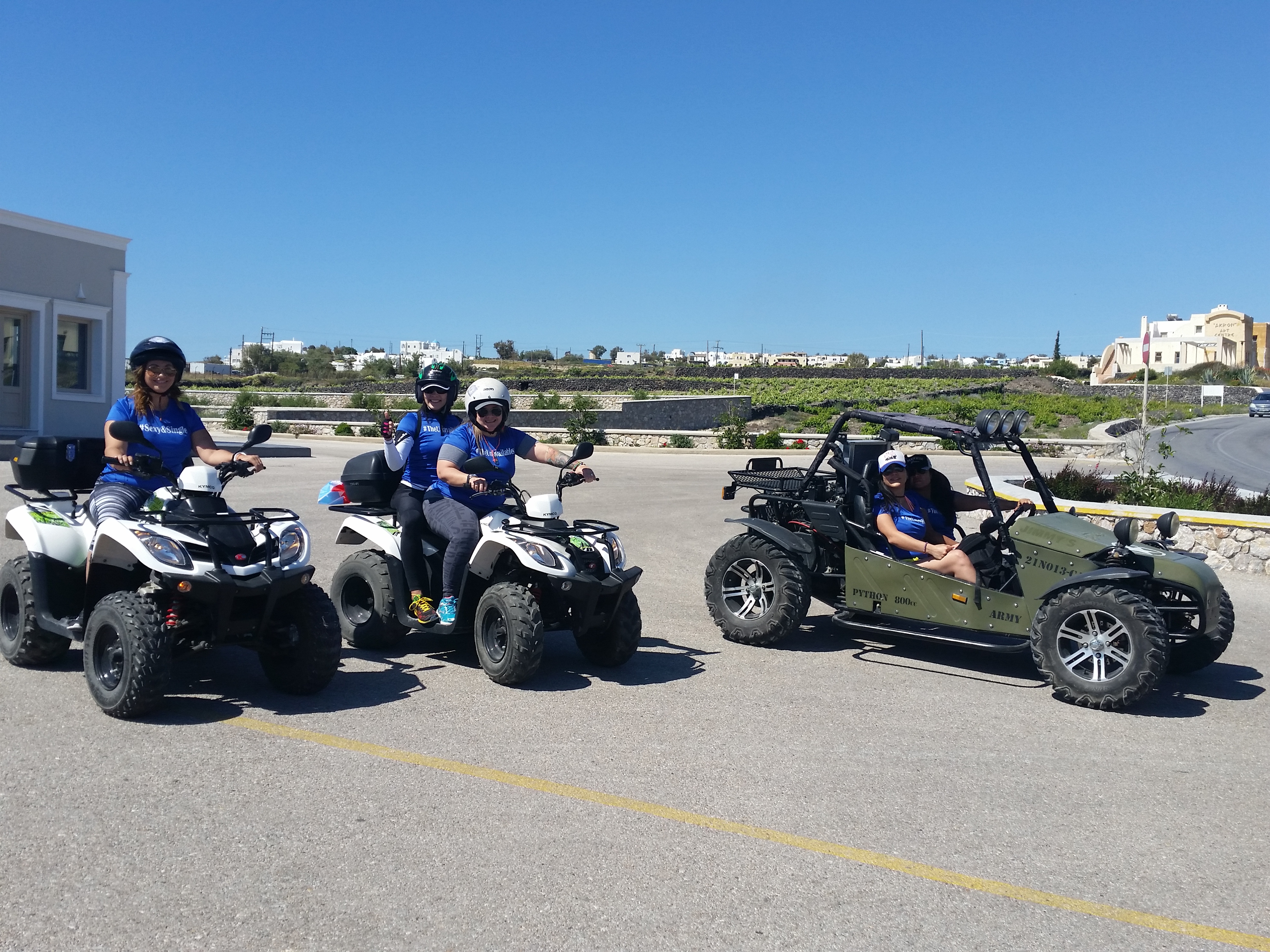 Group of friends with rental ATVs and buggies in Santorini