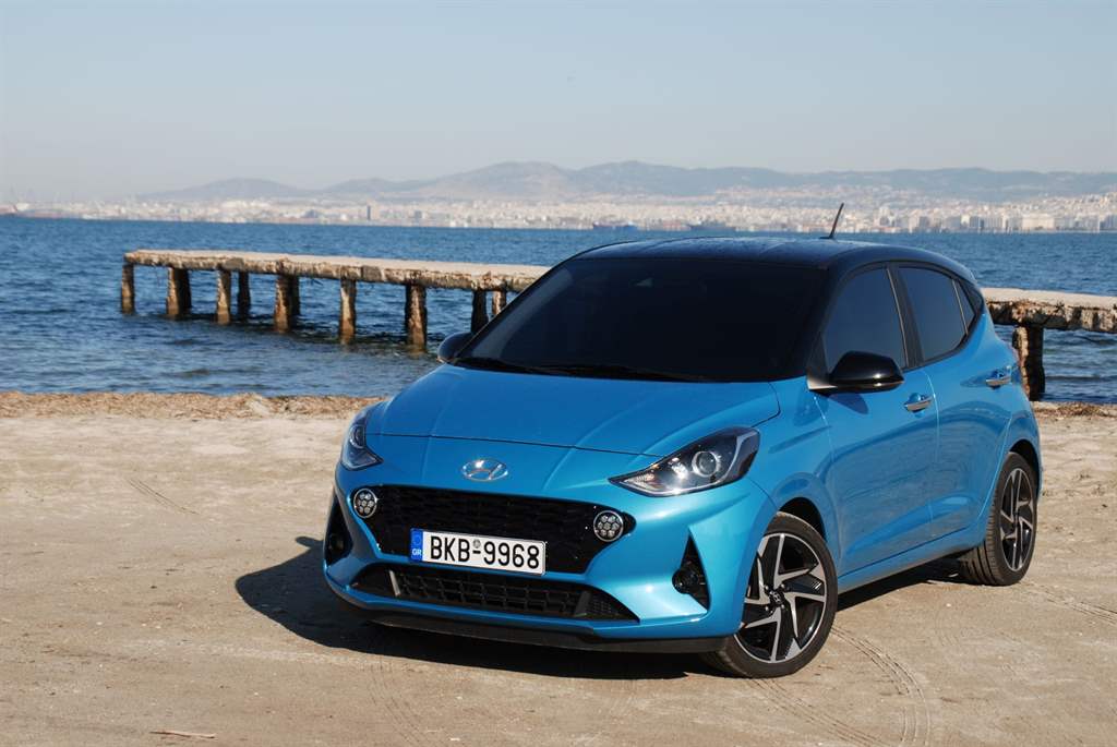 Standard sedan rental ready for a Santorini family trip